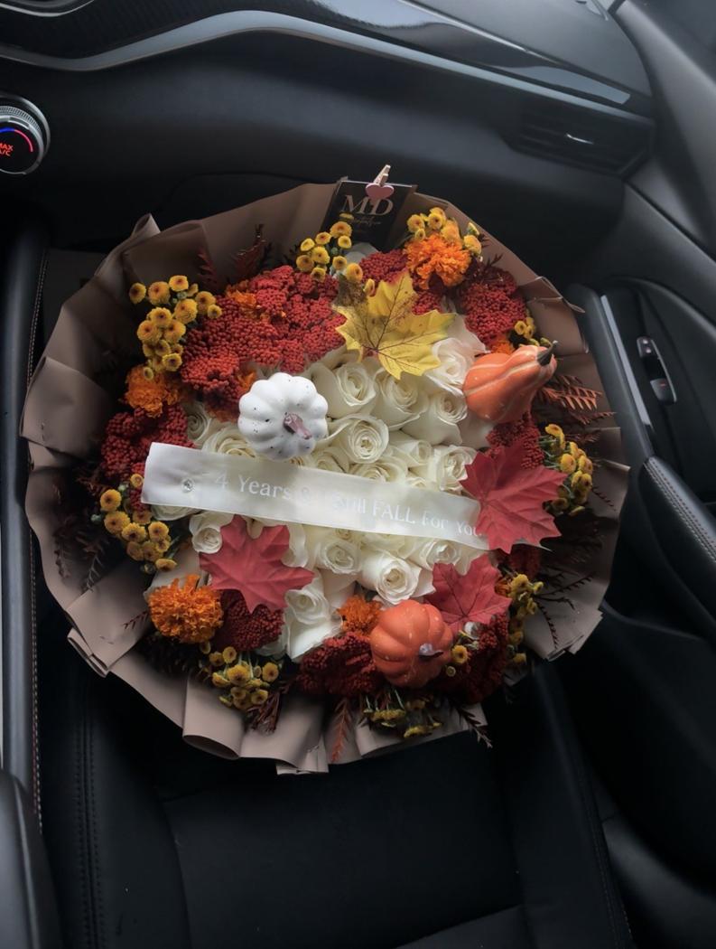 Flessentials fall bouquet with white roses, orange blooms and autumn accents